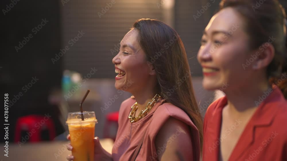 4K Asian woman friends meeting and walking together at chinatown street night market in Bangkok city, Thailand. Female tourist enjoy outdoor lifestyle nightlife travel shopping and eating street food 4K Asian woman friends meeting and walking together at chinatown street night market in Bangkok city, Thailand. Female tourist enjoy outdoor lifestyle nightlife travel shopping and eating street food
