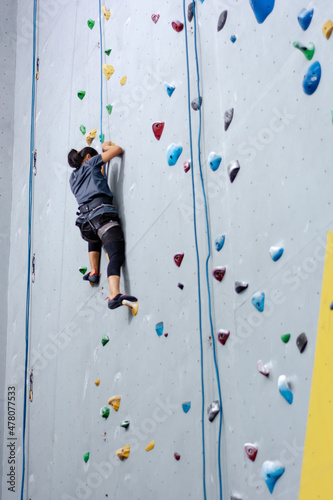 climbing wall background. person climbing on wall