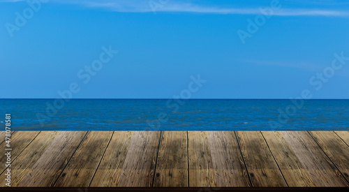 Beautiful wooden floor and blue background  sea water and sky.