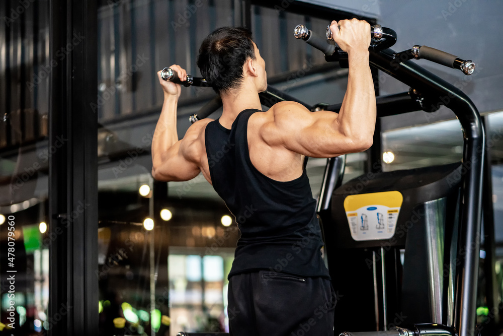 Asian men wear black workout in fitness center