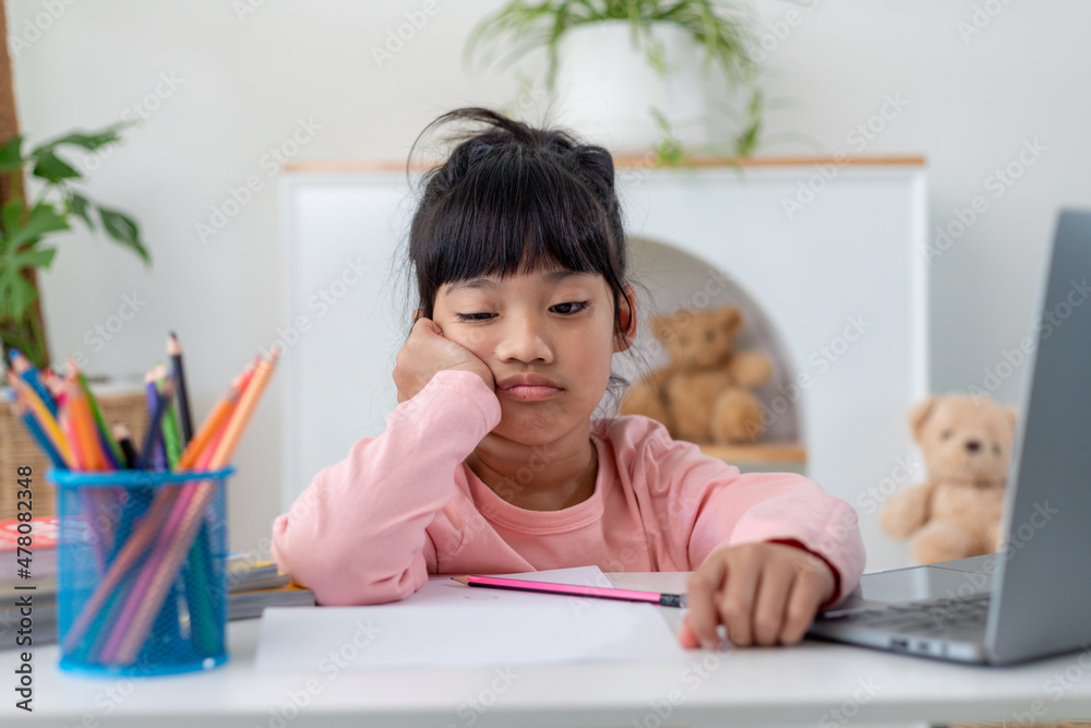 Unhappy little Caucasian girl child sit at table at home feel lazy unmotivated doing homework assignment. Upset distressed small 7s kid prepare school task, learn study with books. Education concept. Unhappy little Caucasian girl child sit at table at home feel lazy unmotivated doing homework assignment. Upset distressed small 7s kid prepare school task, learn study with books. Education concept.
