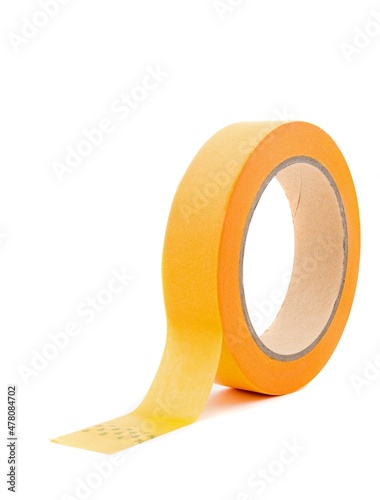 A roll of yellow masking tape isolated on a white background