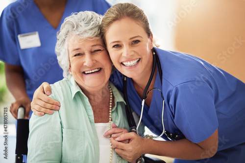 Obraz na plátne Portrait of a smiling nurse with her senior patient in a hospital