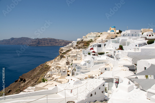 Oia, Greece - July 28, 2021: The white buildings of Oia
