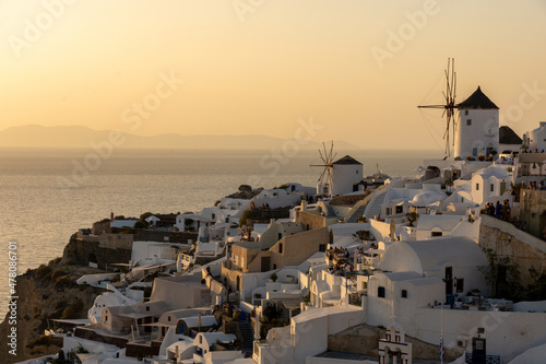The windmills of Oia, Santorini, Greece, during the golden hour