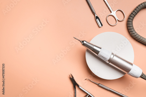 Set of manicure tools and accessories for hardware manicure on a pink background. Hardware manicure. Nail care . Flat lay, top view with Copy space.