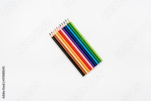 multicolored pencils on a white background