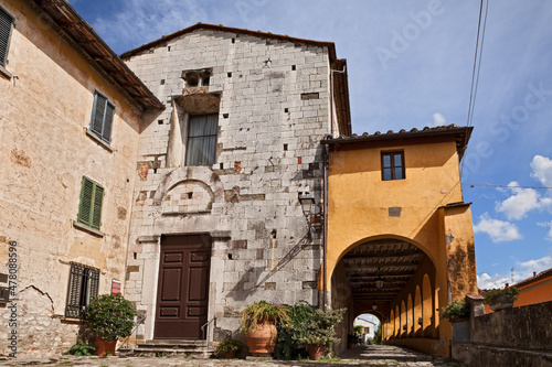 Serravalle Pistoiese, Pistoia, Tuscany, Italy: the medieval church of San Michele Arcangelo and the 17th century portico in the ancient Tuscan village photo