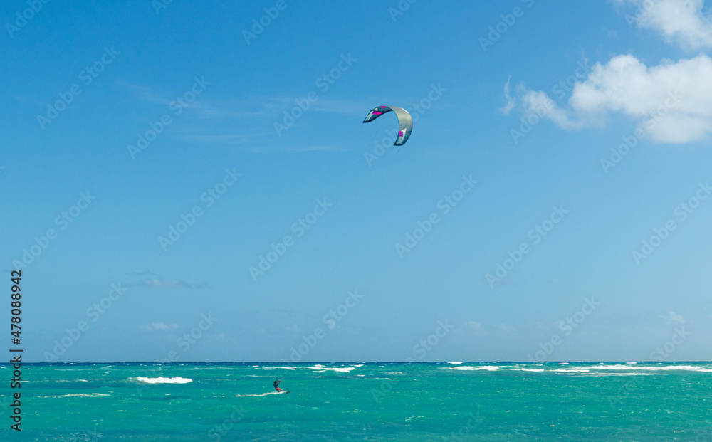 Turquoise ocean blue sky and kiteboarding. Turquoise ocean blue sky and kiteboarding.