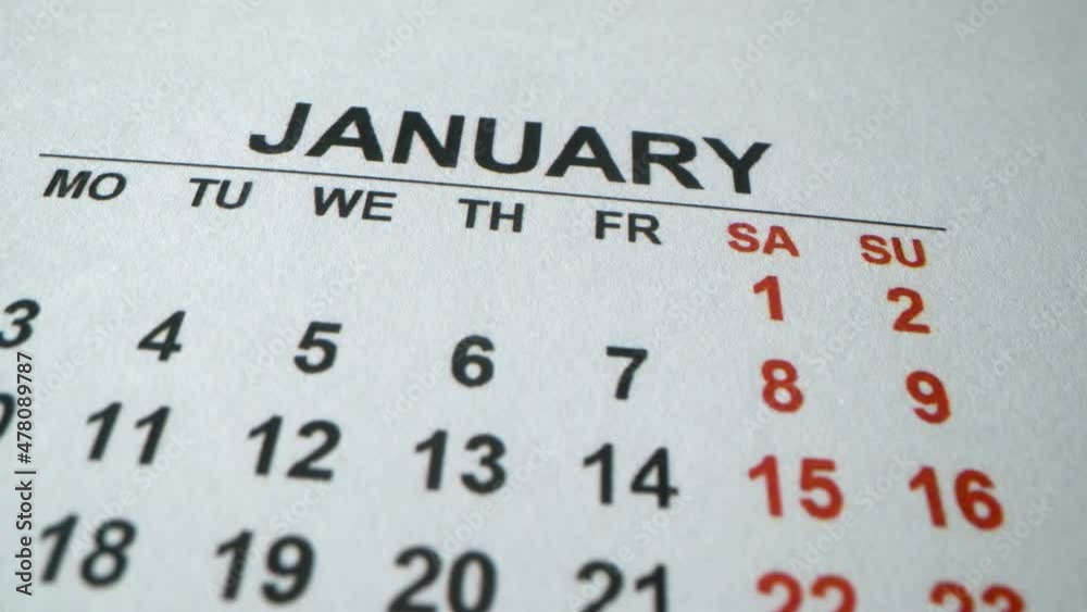 January 2022. Calendar of first month of new year. Holidays and business days. Happy new year and Christmas. Macro shot of detailed calendar. January 2022. Calendar of first month of new year. Holidays and business days. Happy new year and Christmas. Macro shot of detailed calendar.