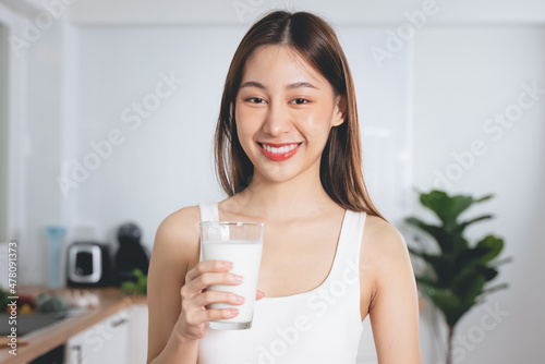 Close up person drinking a glass of milk