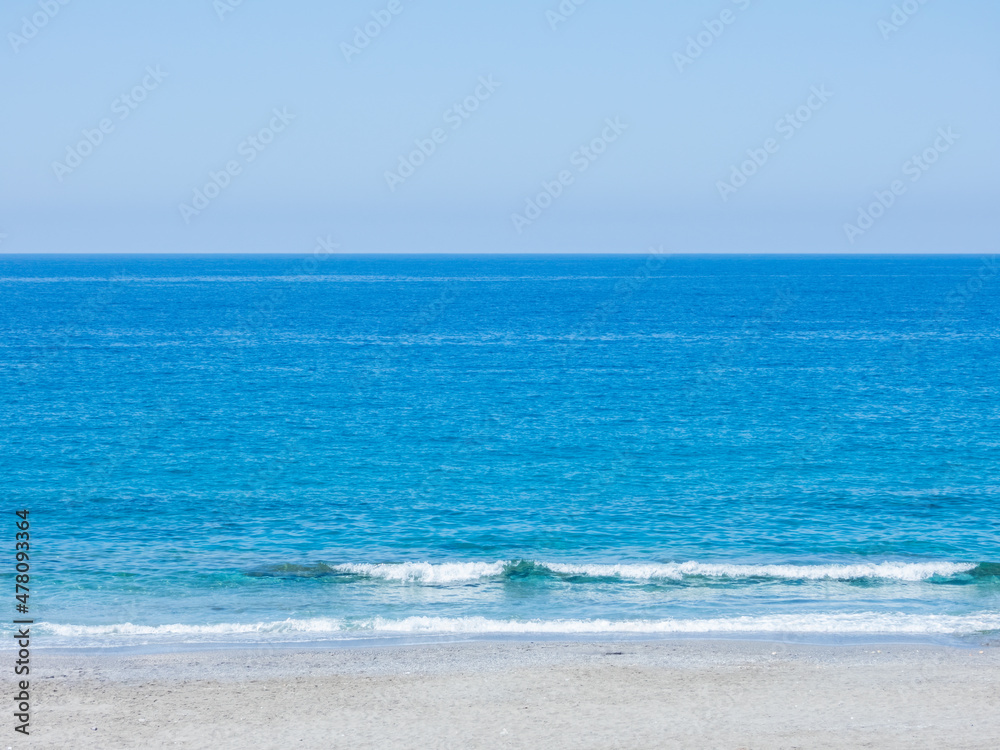 Mediterranean Sea with a fragment of the beach in calm weather