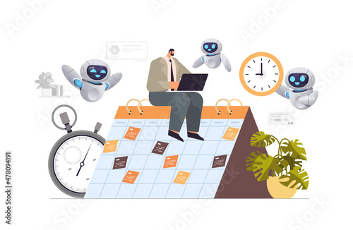 businessman with robots helpers planning day scheduling appointment agenda meeting plan time management