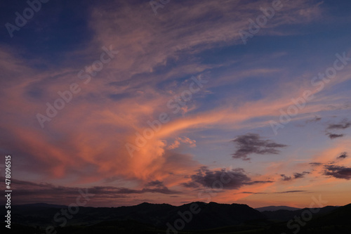 Sunset in the mountains, beautiful clouds. © Arkd