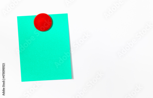 Abstract empty sticky note with red magnet on white board. valentine greeting card message.