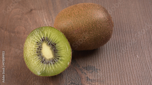 Kiwi fruit on wooden background with copy space. Concept of Healthy food. Tropical fruit.