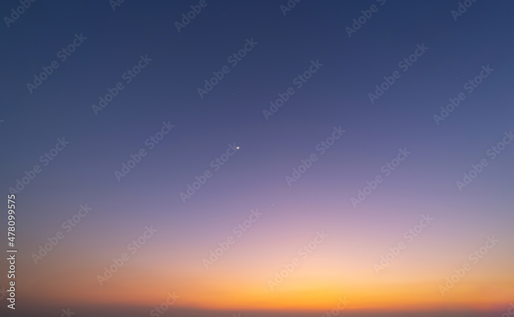 Sunset sky. Abstract nature background. Dramatic blue with orange colorful clouds in twilight time. Sunset sky. Abstract nature background. Dramatic blue with orange colorful clouds in twilight time.