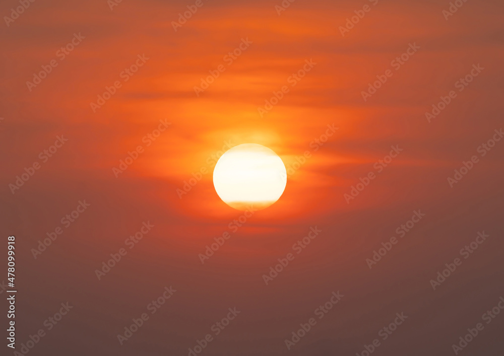 The Sun with sunset sky. Abstract nature background. Dramatic blue with orange colorful clouds in twilight time.