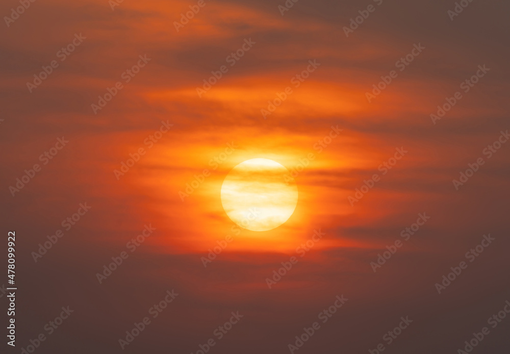 The Sun with sunset sky. Abstract nature background. Dramatic blue with orange colorful clouds in twilight time.