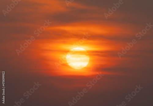 The Sun with sunset sky. Abstract nature background. Dramatic blue with orange colorful clouds in twilight time.