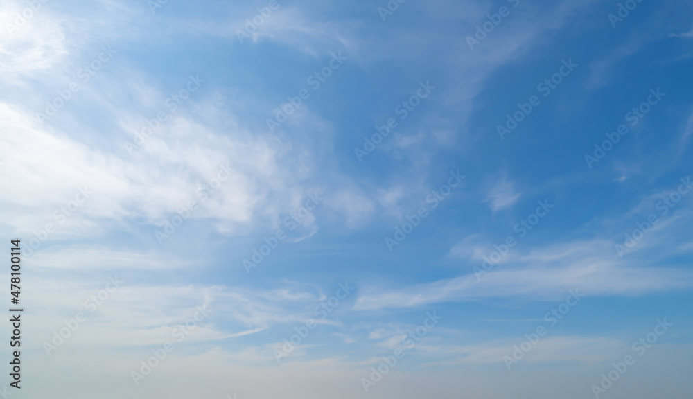 Clear blue sky with white fluffy clouds at noon. Day time. Abstract nature landscape background. - obrazy, fototapety, plakaty 