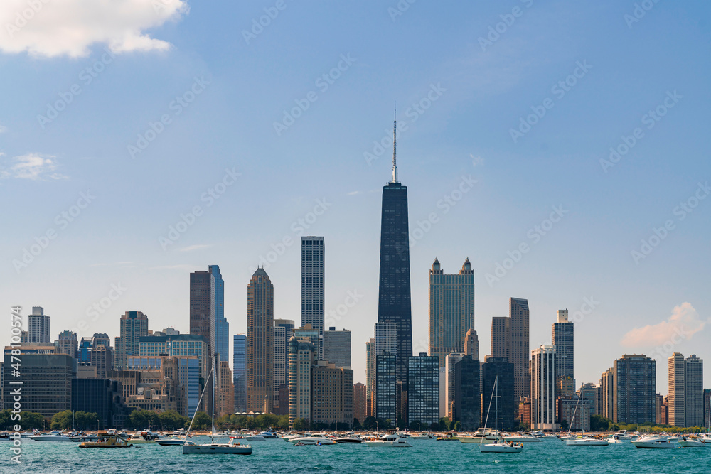Fototapeta premium A picturesque view of Downtown skyscrapers of Chicago skyline panorama over Lake Michigan at daytime, Chicago, Illinois, USA
