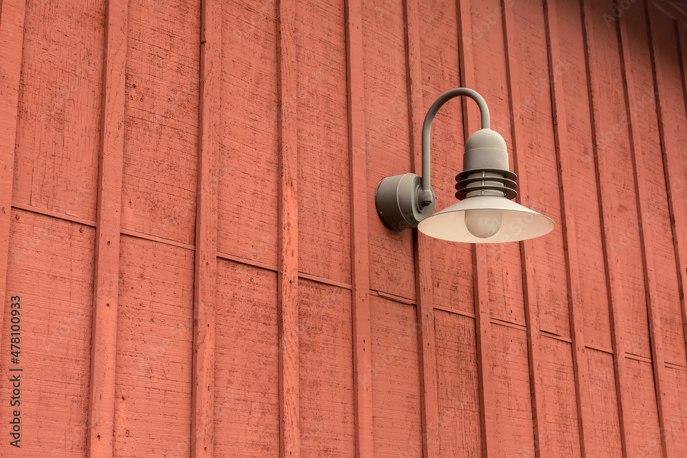 Barn light on a warehouse wall