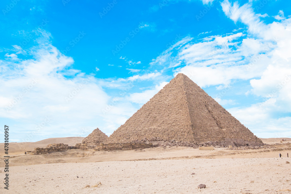 Great Sphinx against the background of the pyramids of the pharaohs Cheops, Khafren, and Mikerin in Giza, Egypt