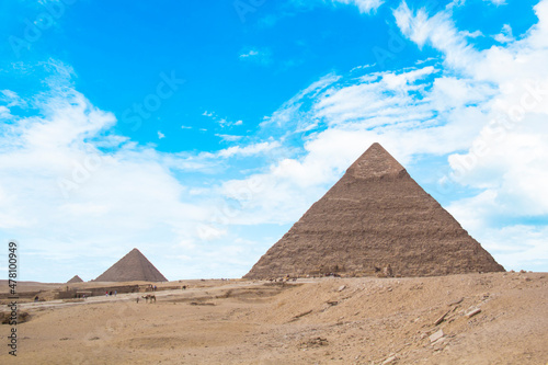 Great Sphinx against the background of the pyramids of the pharaohs Cheops  Khafren  and Mikerin in Giza  Egypt