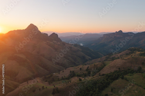 Aerial top view of forest trees and green mountain hills. Nature landscape background, Thailand.