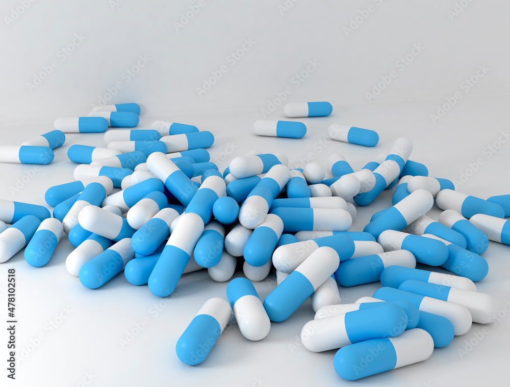many blue pills diagonally poured on a white background many blue pills diagonally poured on a white background