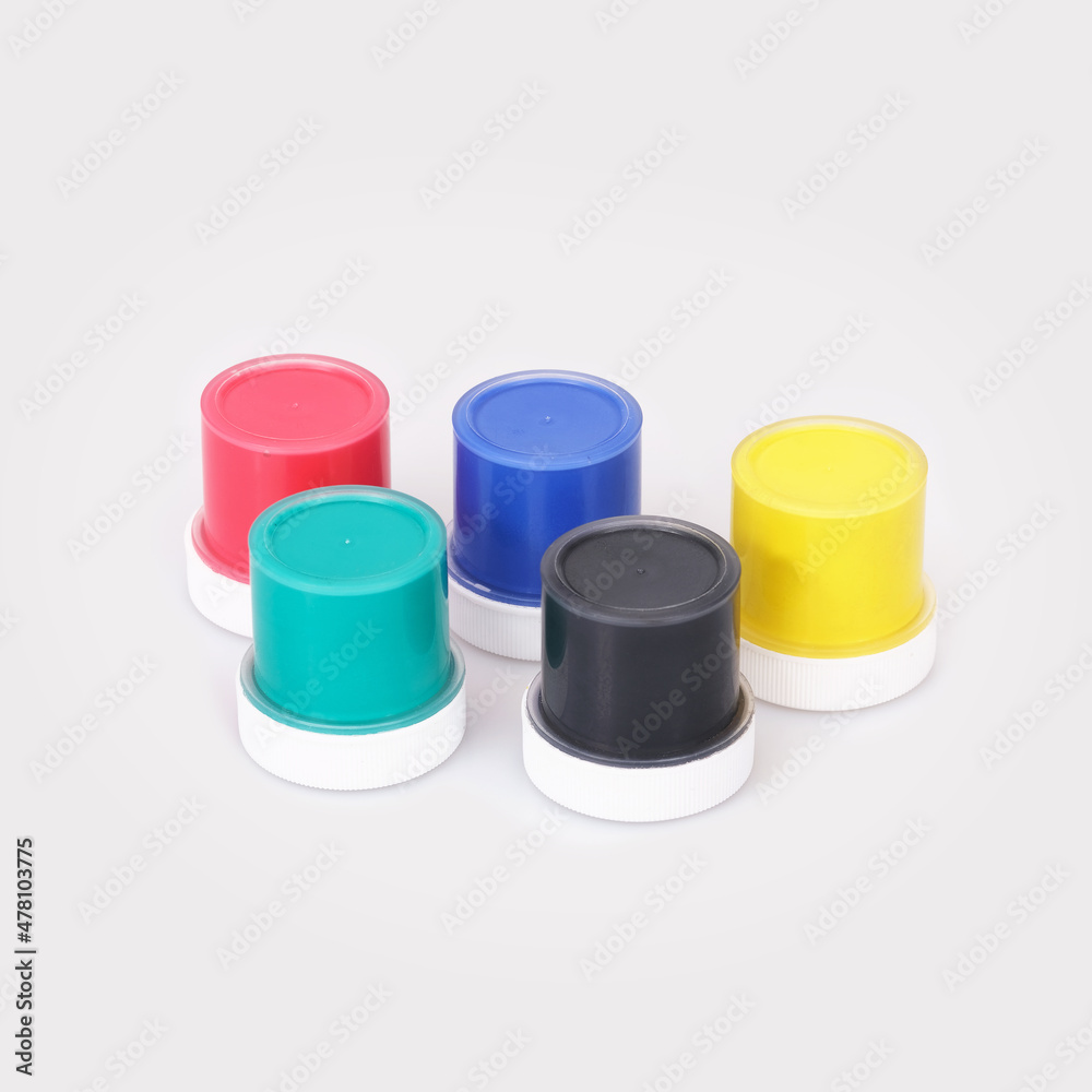 Bottles with multicolored gouache isolated on white background