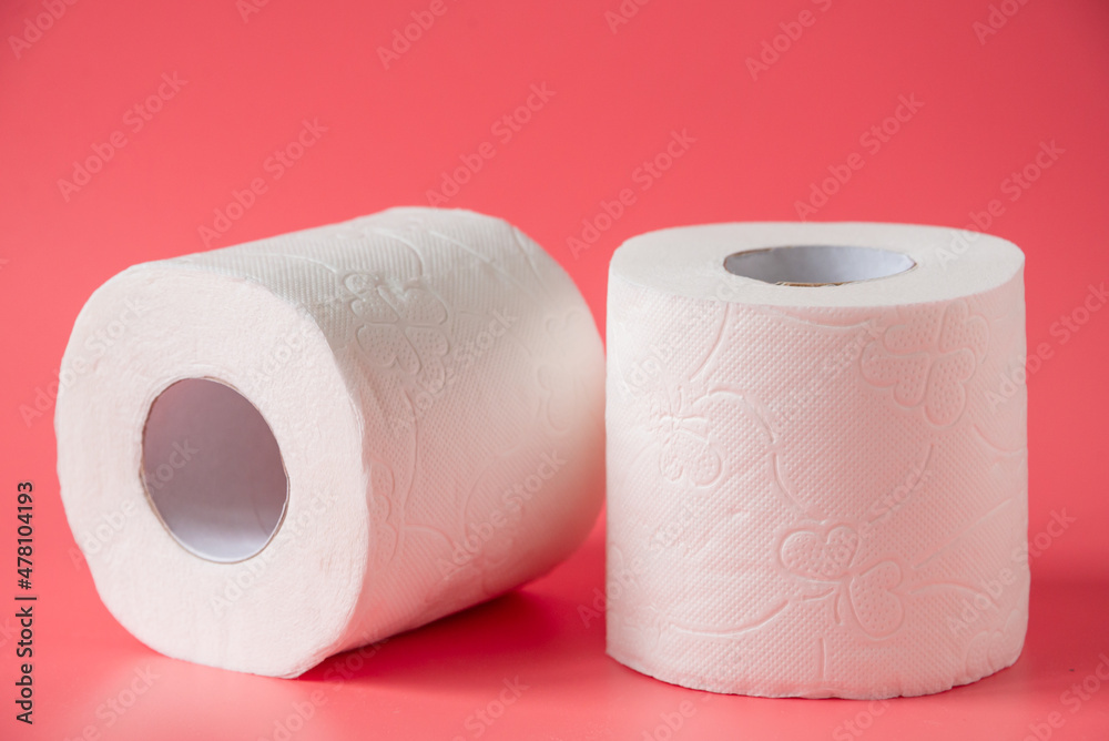 Toilet paper on pink background Toilet paper on pink background