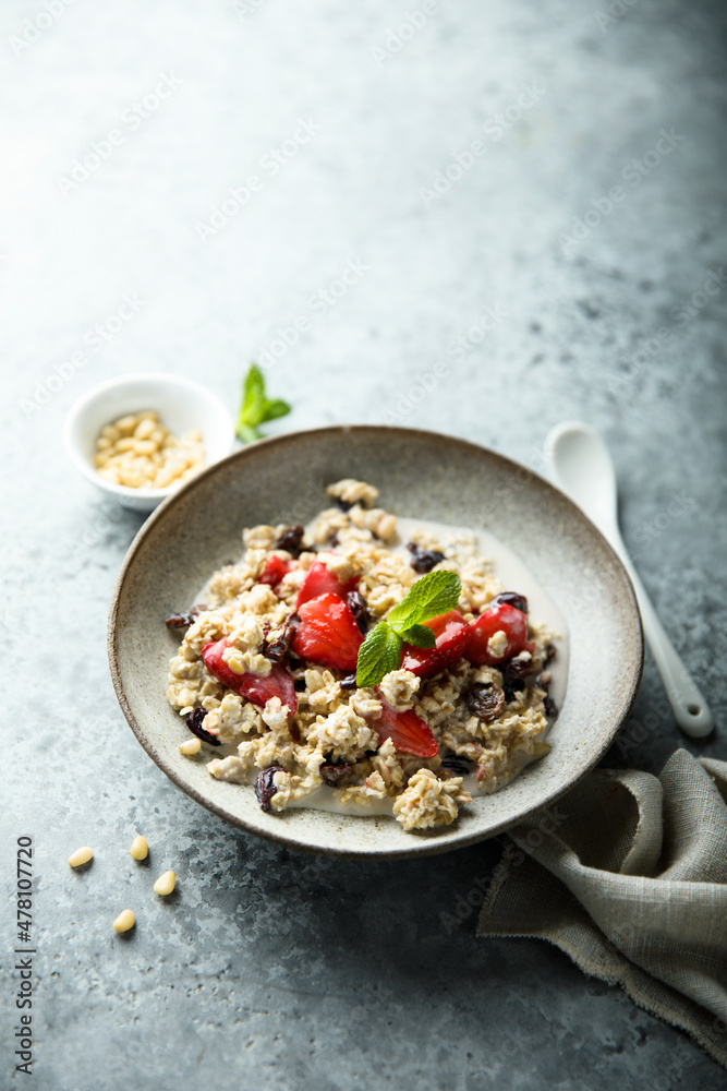 Healthy homemade muesli or oatmeal porridge with strawberry