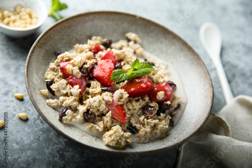 Healthy homemade muesli or oatmeal porridge with strawberry