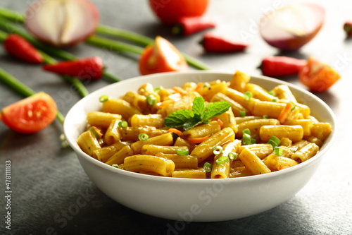 Homemade delicious pasta penne with fresh cheese and cream.