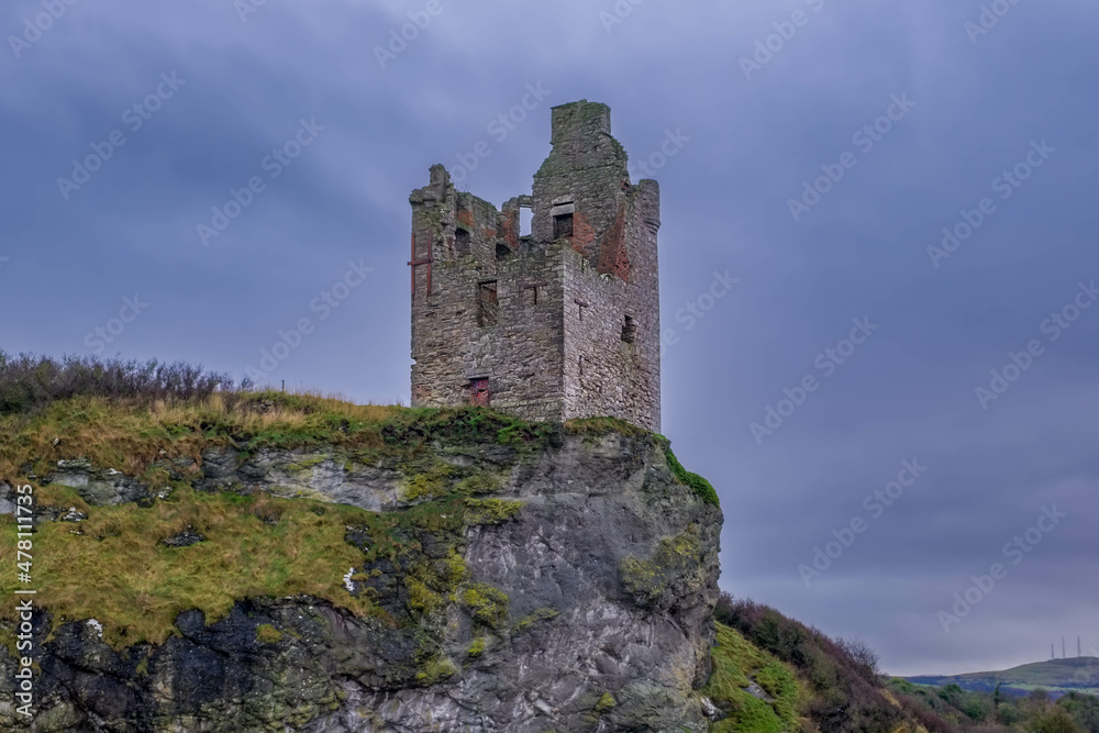 The Crumbling Ancient Ruins of Greenan Castle looking over From Greenan Bay in Ayrshire Scotland
