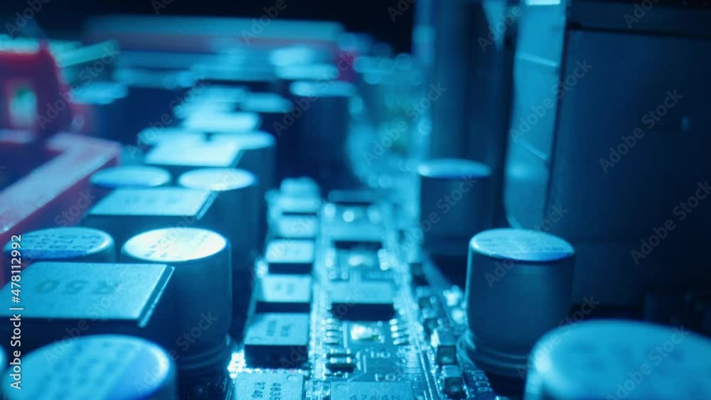 Motion above computer motherboard at purple and blue light