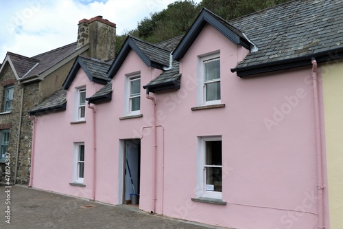 Lower Fishguard Harbour View with Traditional Pink Cottages in Pembrokeshire, South Wales, UK
