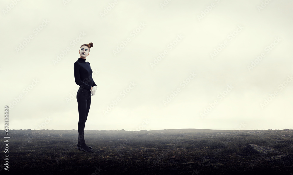 Female mime with white face