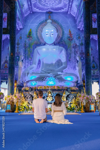 Blue Temple Chiang Rai Thailand, Rong Sua Ten temple, Chiang Rai Blue Temple, or Wat Rong Seua Ten is located in Rong Suea , couple visit a temple in Thailand, man and woman vacation Asia photo