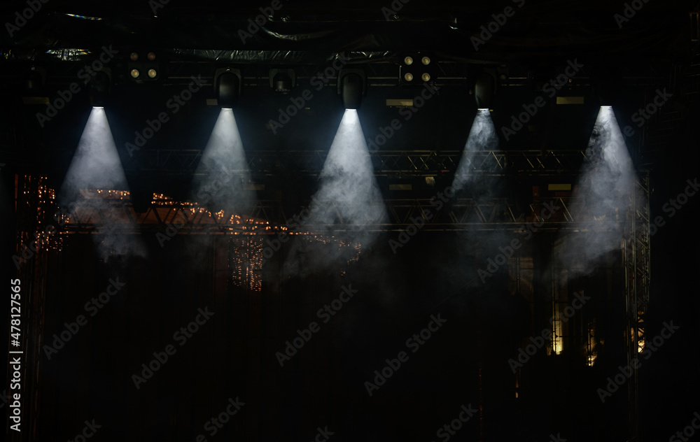 Lights setup on a stage before a concert. Dramatic mood. Spot light.