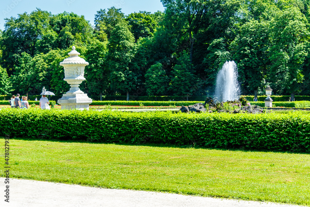 Formal garden with ornamental urns and fountain