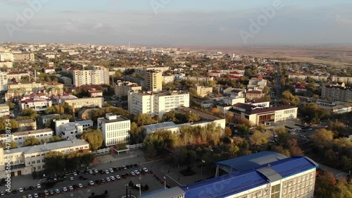 flight over the city at sunset