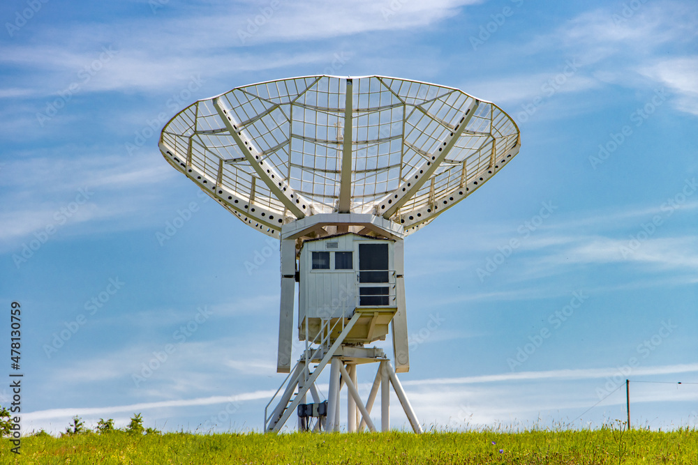 Ionospheric observatory with a giant satellite dish for receiving a satellite signal.