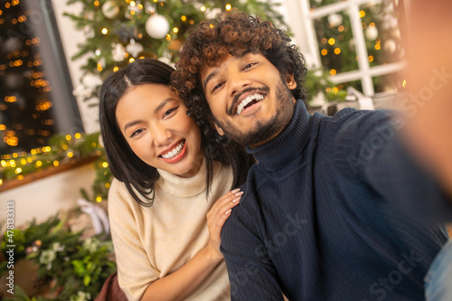 Close-up man and woman smiling at camera