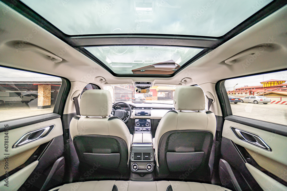 Car inside. Interior of prestige modern car. Comfortable leather seats. Black cockpit with on isolated white background.