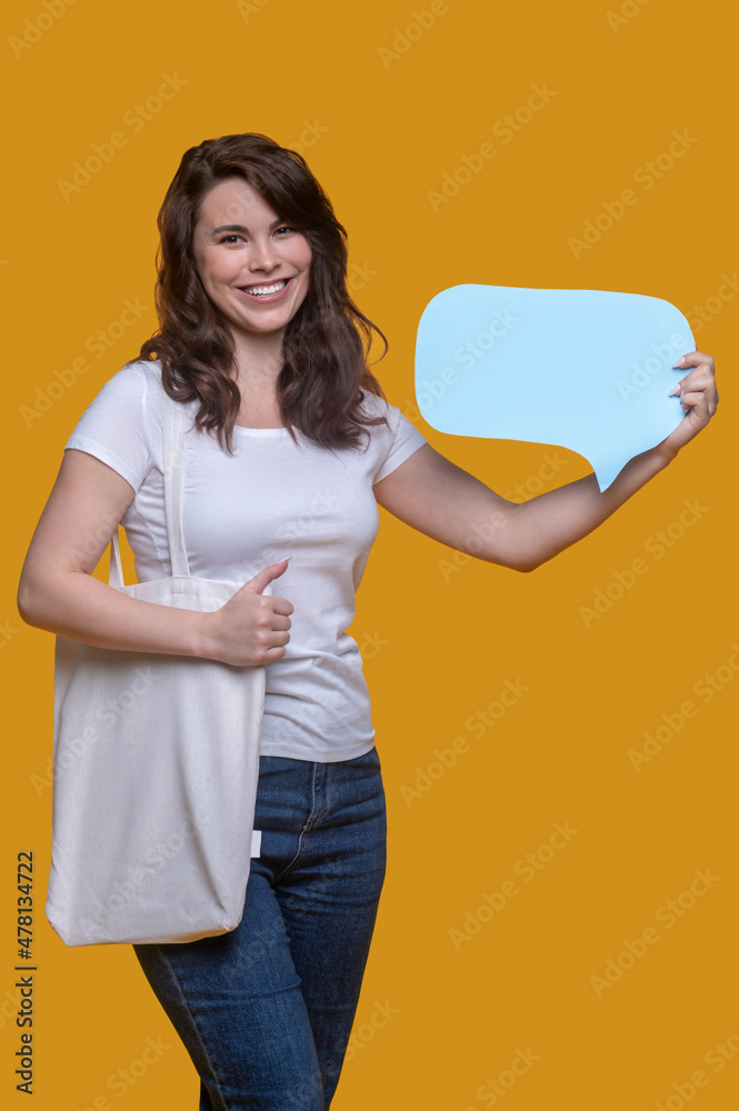 Joyful girl showing question sign before the camera Joyful girl showing question sign before the camera