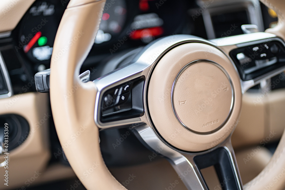 multimedia control panel on the steering wheel of a modern car - obrazy, fototapety, plakaty 