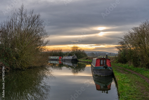 Canal and towpath with winter clouds and sun in the background © Simon Guettier